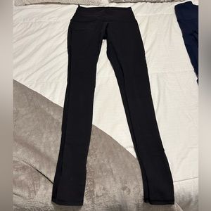 Black lululemon leggings with shed on the back